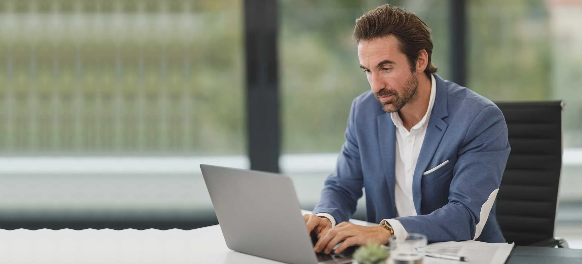 Business consultant working on laptop